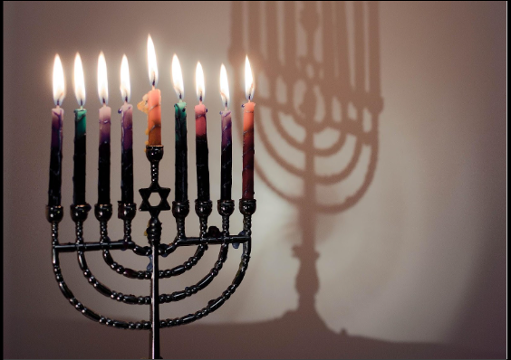 An image of a fully lit Menorah, glistening brightly.