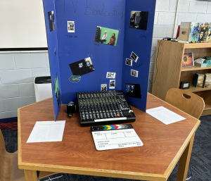 The Broadcasting table at the electives fair. I cant wait to go this route, says Spencer Barrett, grade 8.