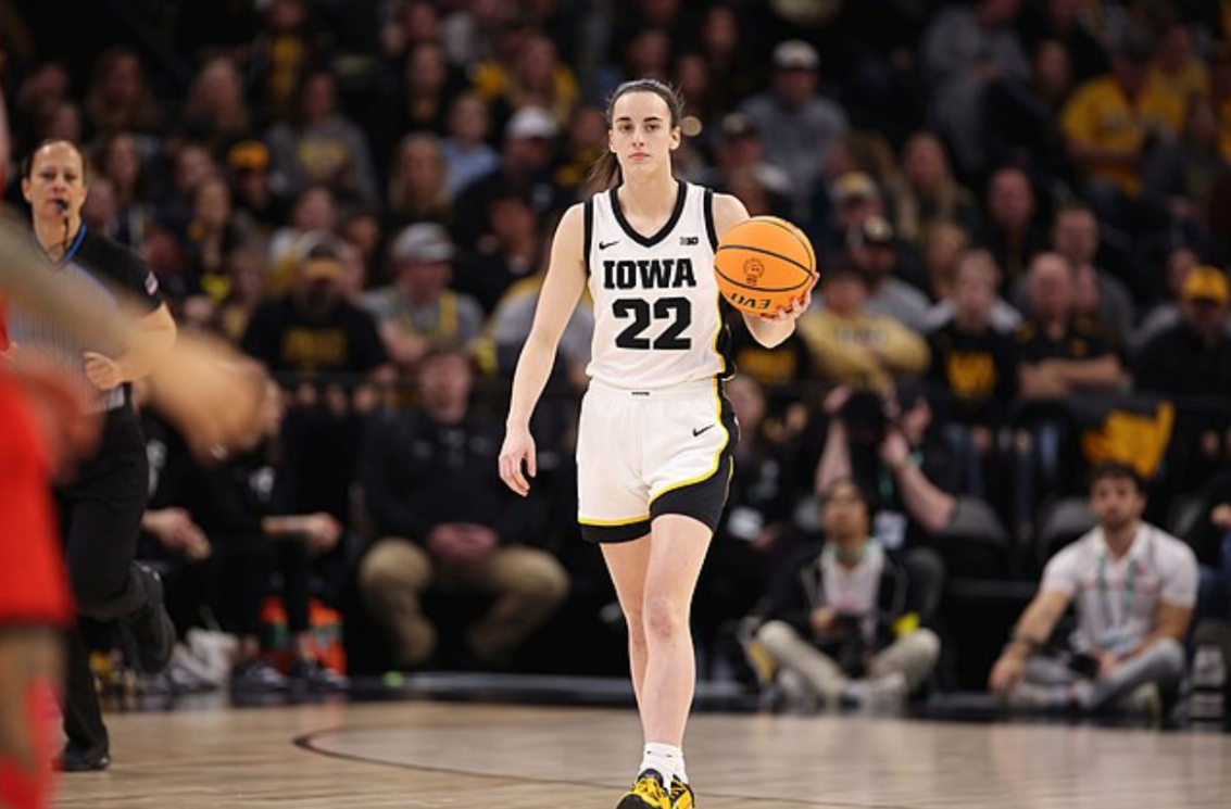 Caitlin Clark dribbles the ball up the court in the Big Ten Championship between Iowa and Ohio State