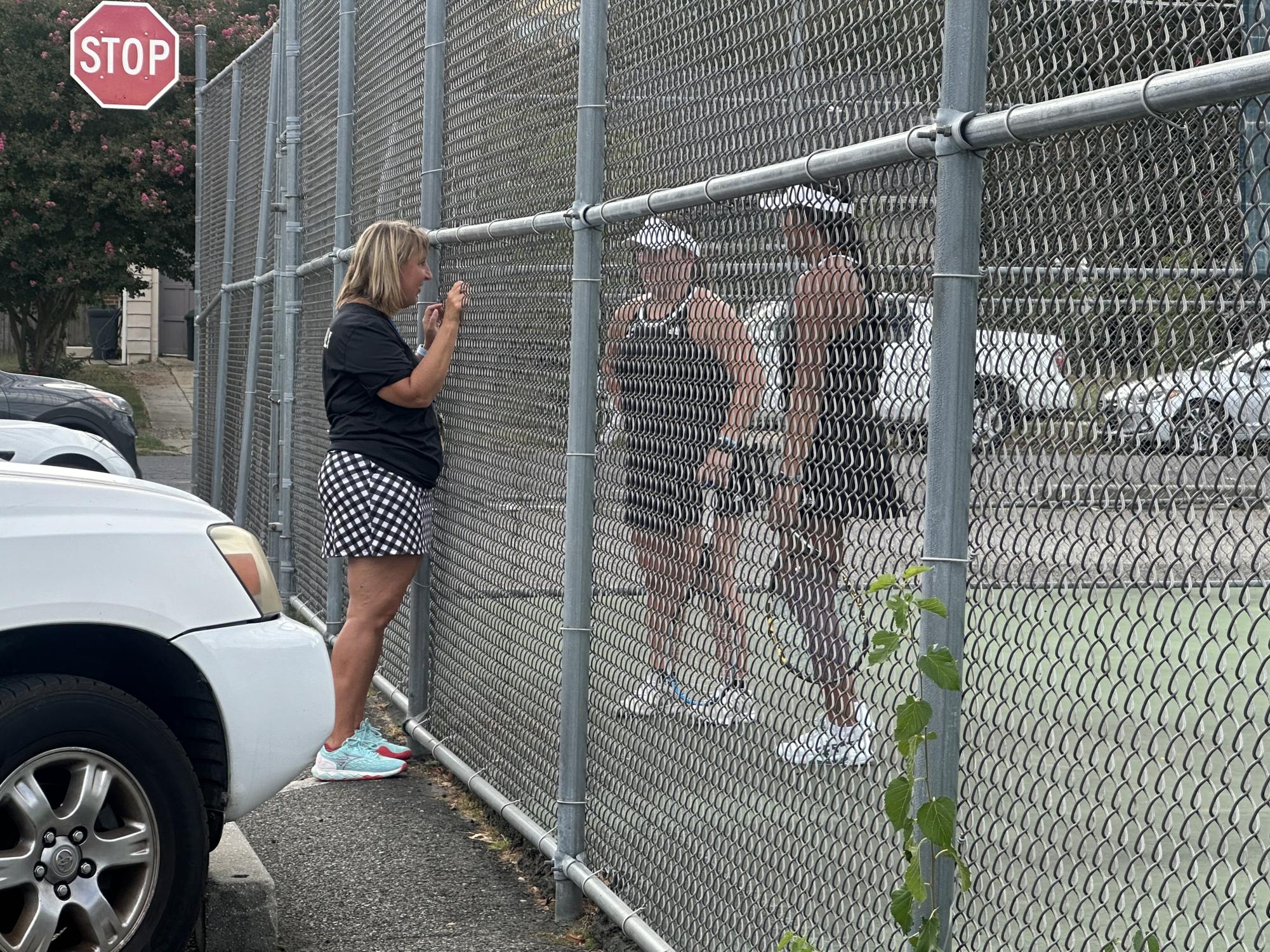 Mrs. McAnally talking to the second doubles