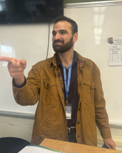 Mr. Al-Habshi pointing at something in the distance