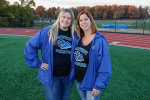 One of the many things Mrs. Genzano does is coach the cheer team! Mrs. Genzano is featured on the right next to her best friend and colleague, Mrs. Evans on the left.