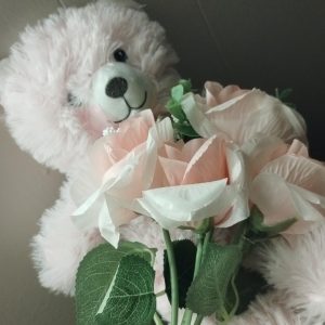 To celebrate the upcoming Valentine’s Day, I bought a teddy bear and artificial flowers for my mom.