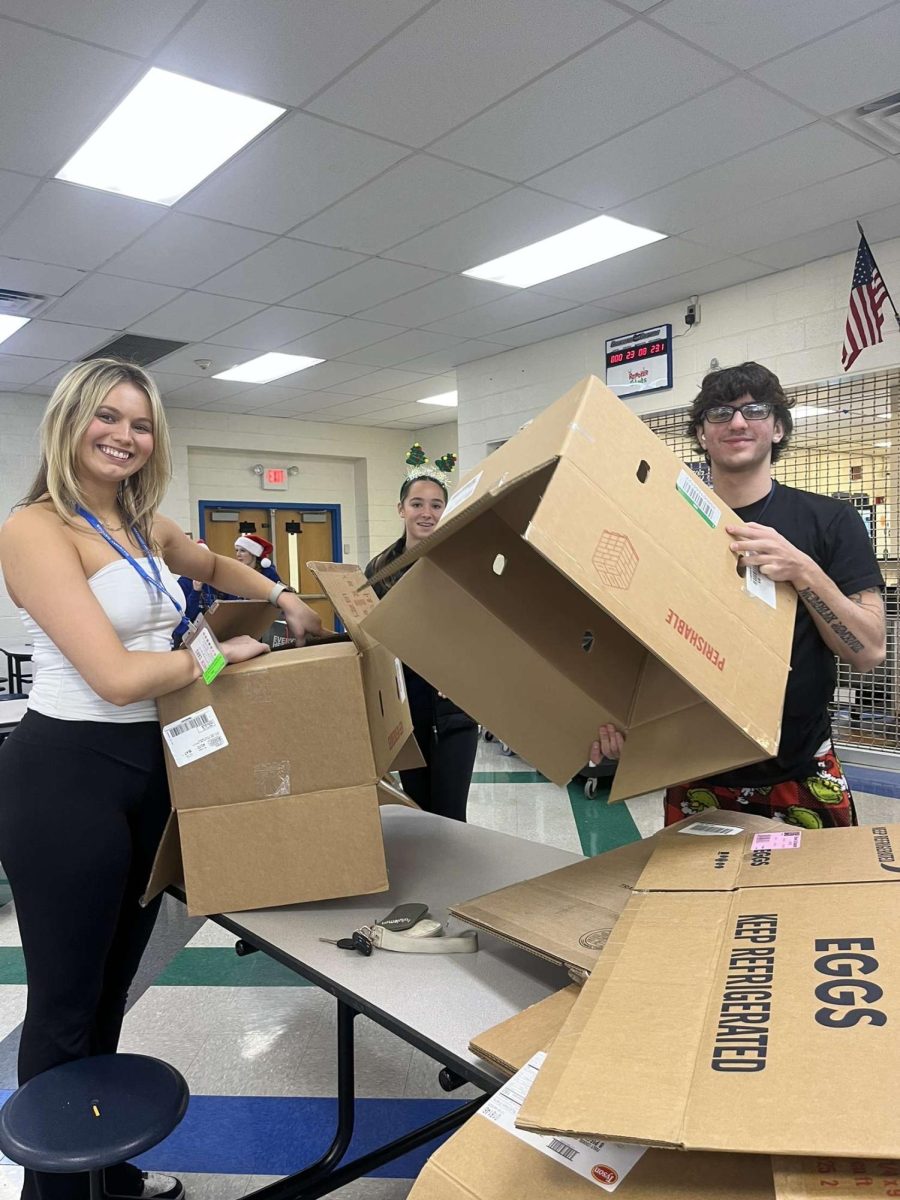 Student council members breaking down boxes