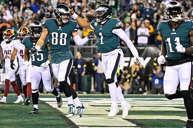 The Eagles offense celebrates a touchdown. Of note are Jalen Hurts (#1) A.J. Brown (#11) Dallas Goedert (#88)