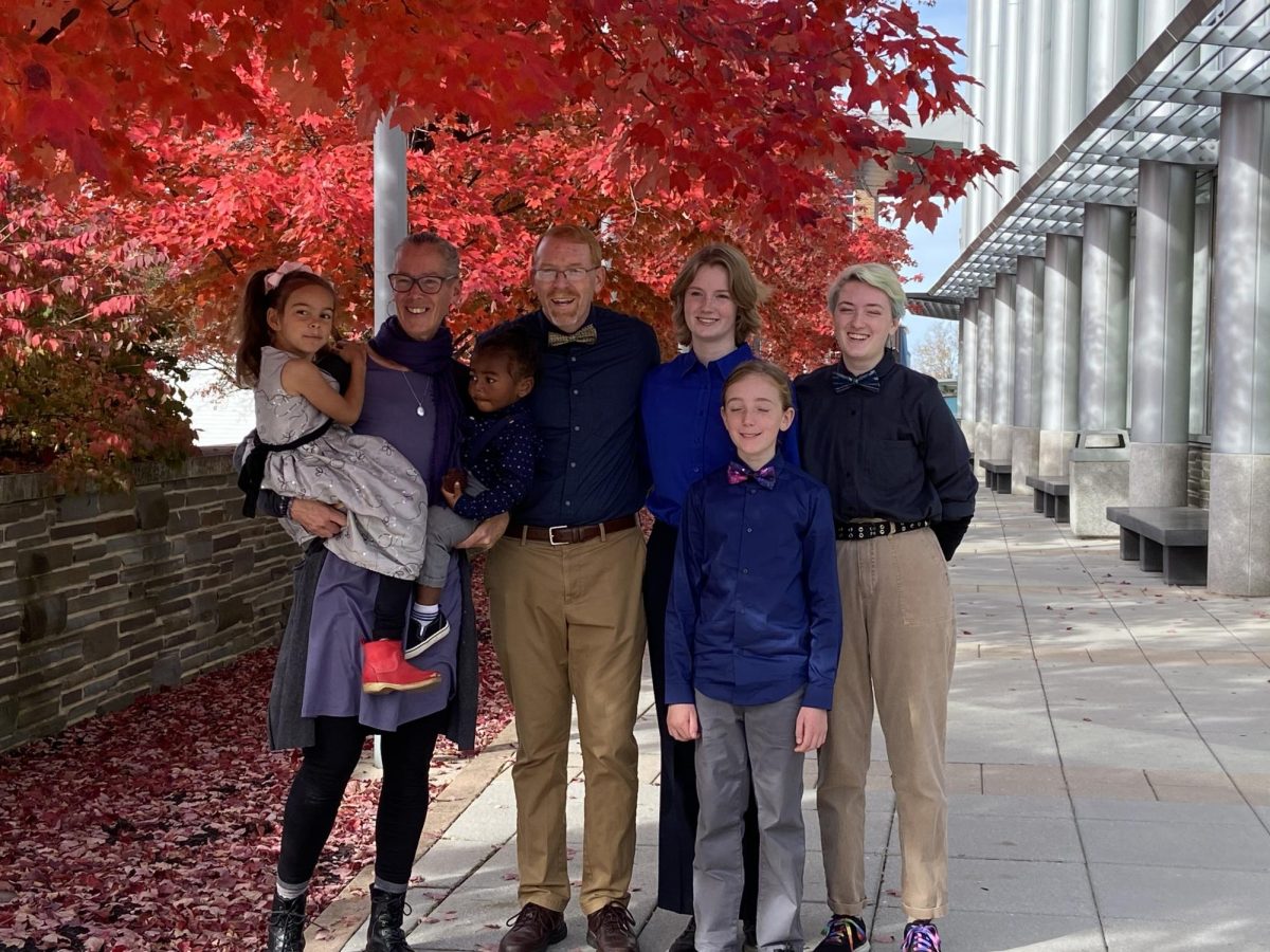 My family standing outside the court house after adopting my youngest sibling, Ba'kari, from foster care